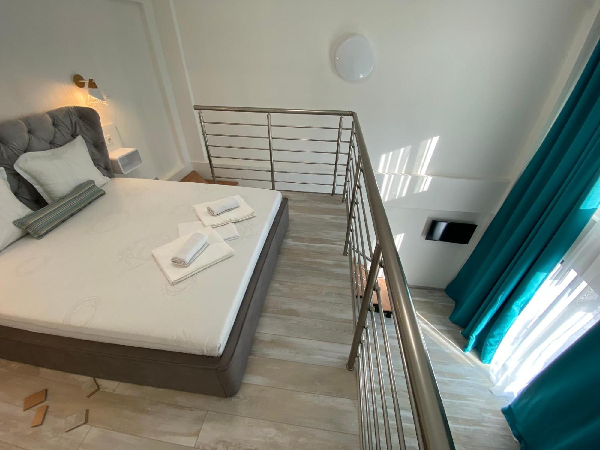 Opalium Beach Front Suites Потос Екстериор снимка