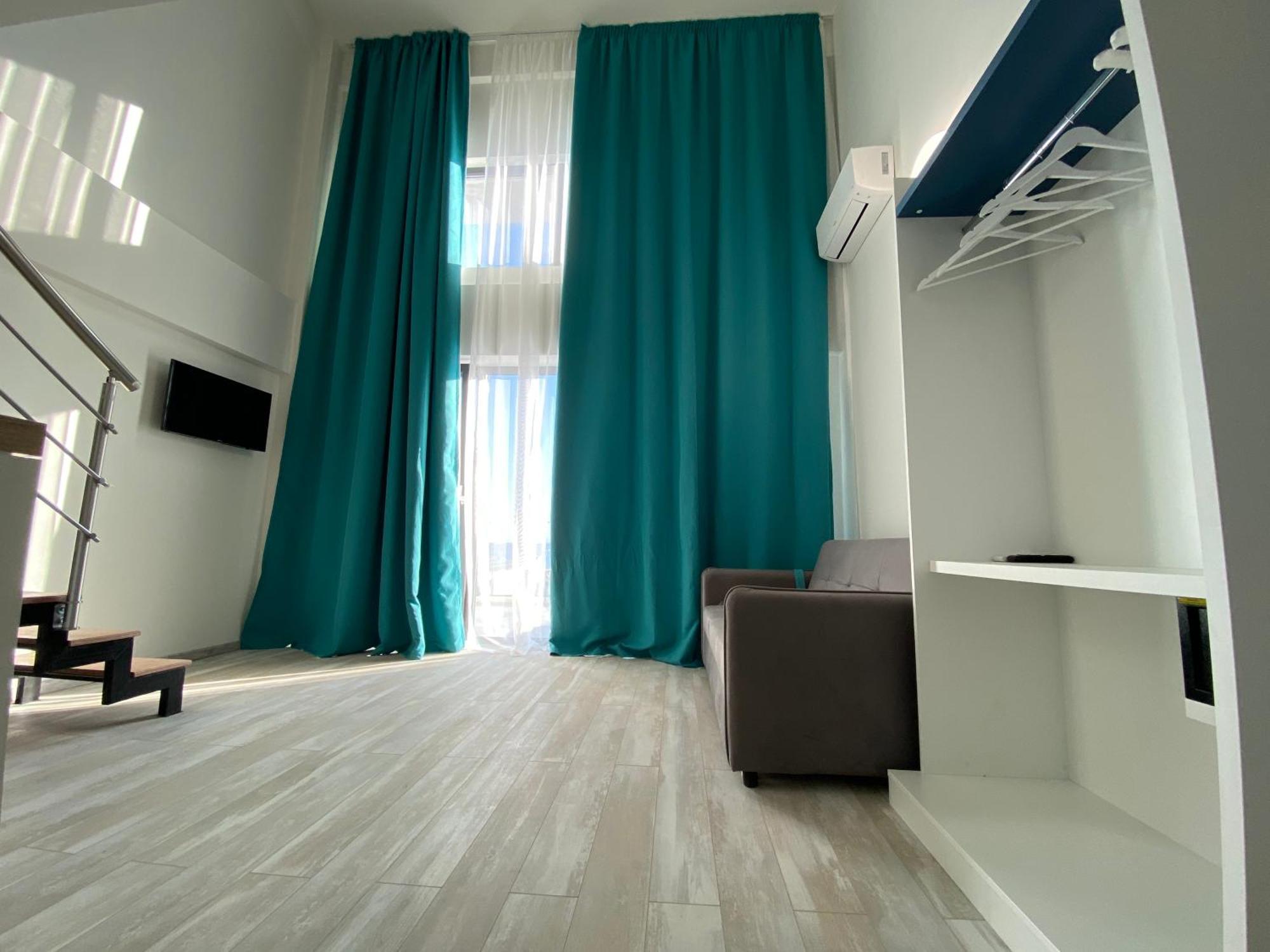 Opalium Beach Front Suites Потос Екстериор снимка